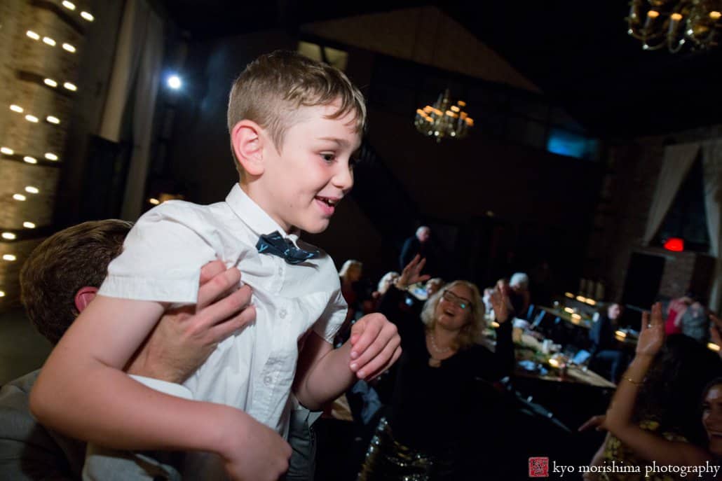 Young boy enjoys dancing with music by DJ OP! at Green Building wedding in Brooklyn, photographed by Kyo Morishima