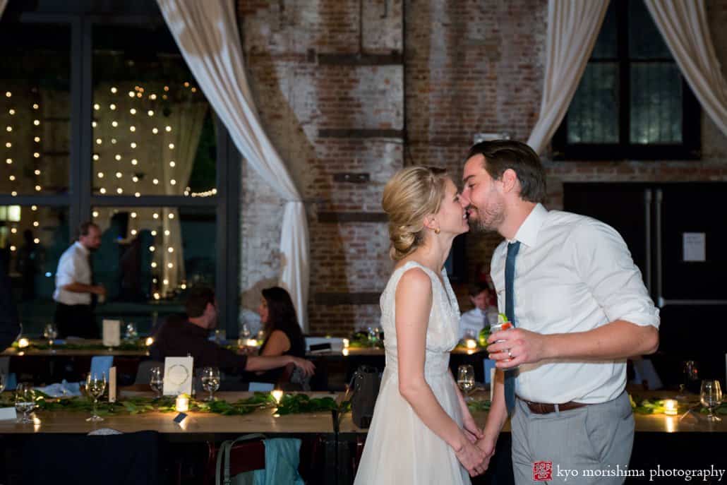 Tender moment between bride and groom at industrial-style Brooklyn wedding venue The Green Building, photographed by Kyo Morishima