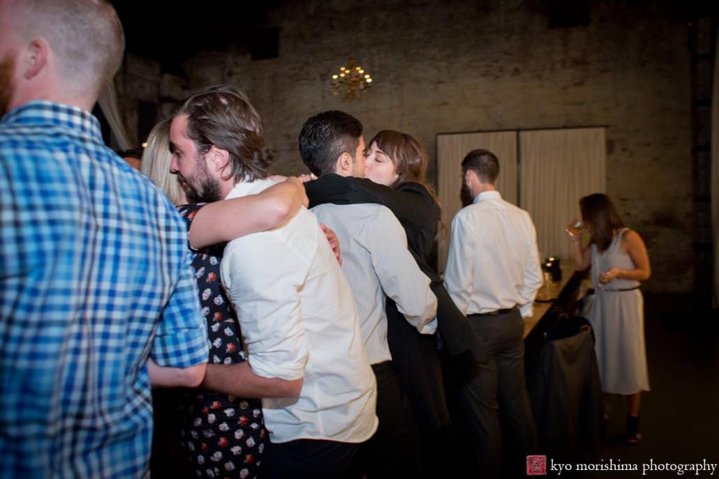 Guests kiss during dancing with music by DJ OP! at Green Building wedding photographed by Kyo Morishima