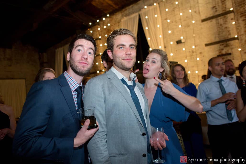Guests pose for camera on the dance floor at Green Building wedding in Brooklyn, photographed by Kyo Morishima