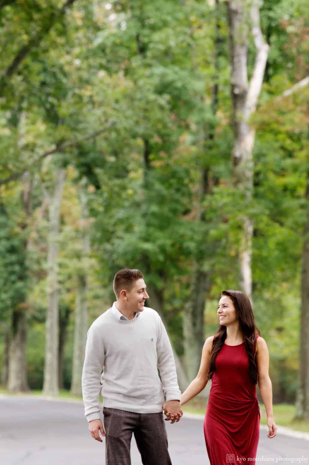Engagement picture with red dress on the driveway at Jasna Polana, Princeton, photographed by Kyo Morishima