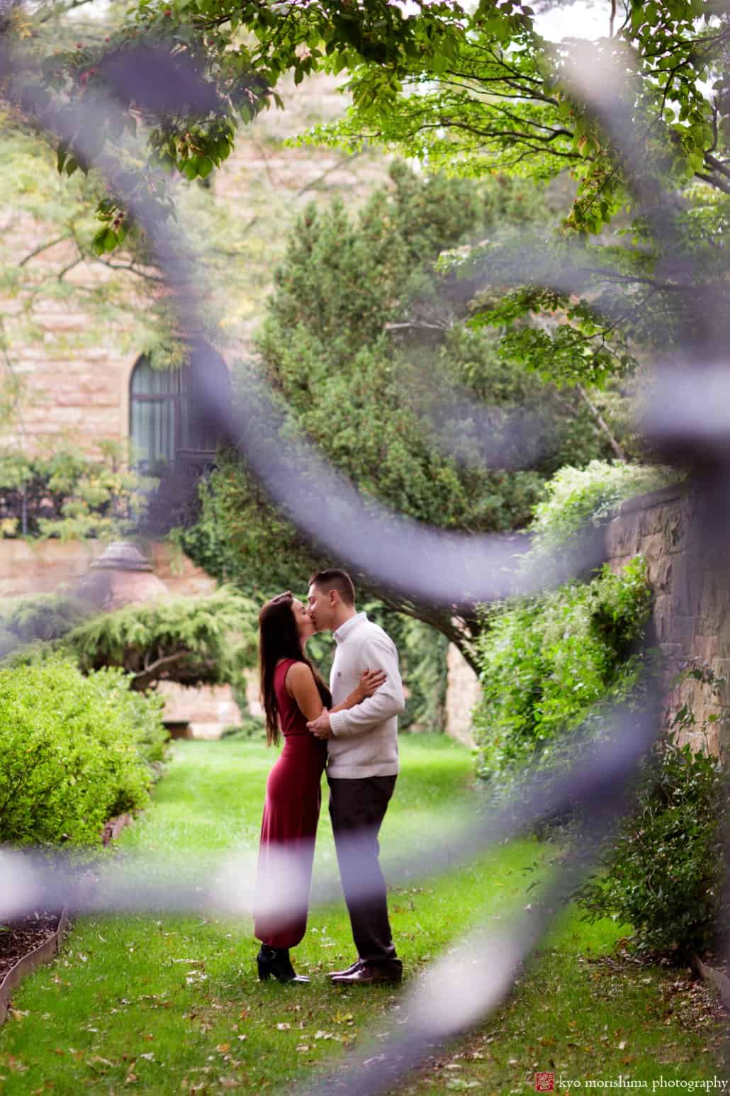 Jasna Polana engagement picture photographed through decorative grillwork