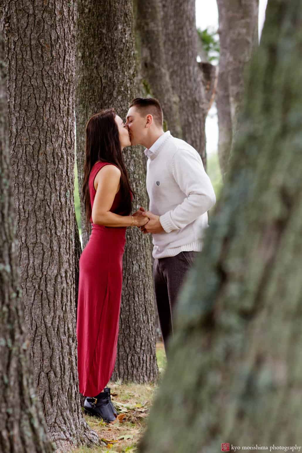 Princeton engagement picture in a grove of trees at Jasna Polana, photographed by Kyo Morishima
