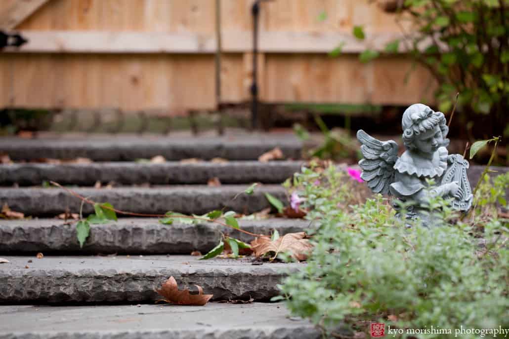 Princeton garden vignette with stone angel statue photographed by Kyo Morishima