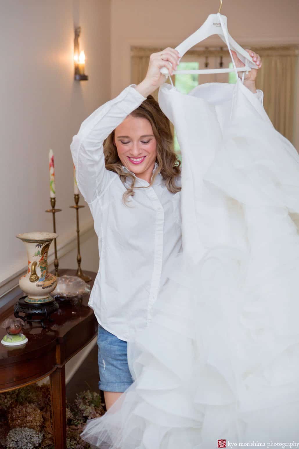 Bride carrying Pronovias wedding dress