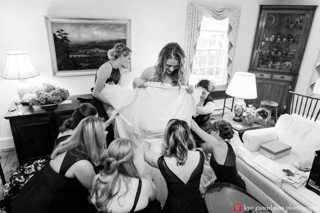 Bride putting Pronovias wedding dress on, photographed by Kyo Morishima