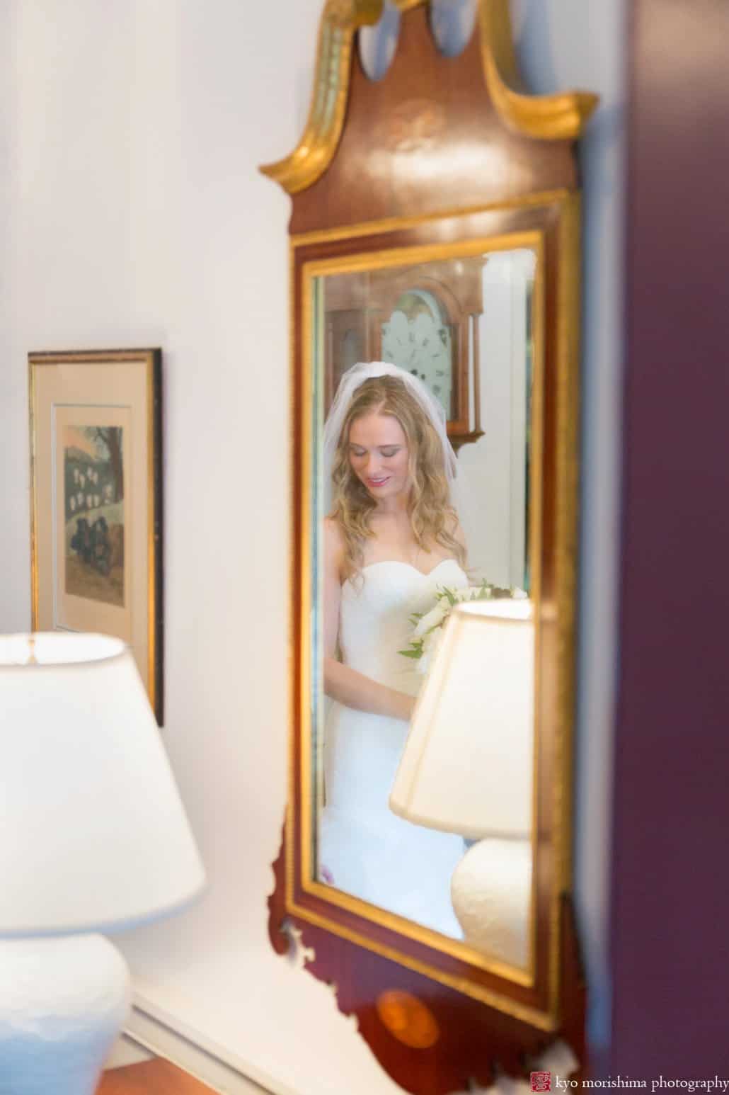 Bride reflected in a Colonial mirror in her grandparents' home in Princeton