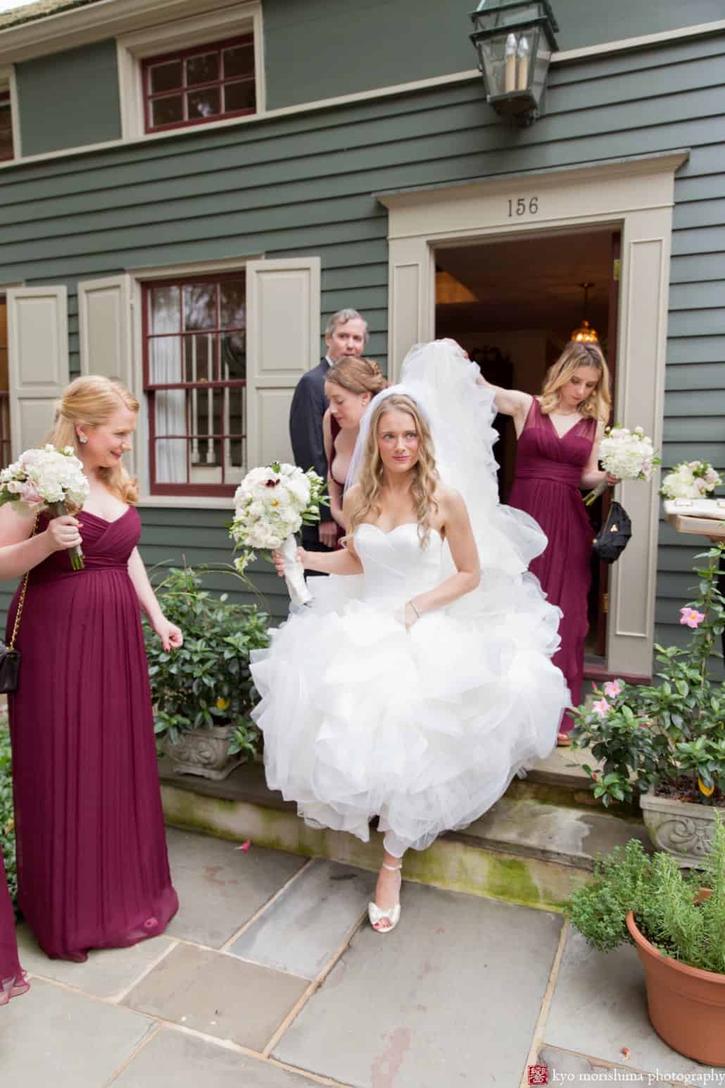 Bride emerges from grandparents' house wearing filmy ruffled Pronovias wedding gown