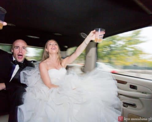 Bride and groom toast during A-1 Limo ride to Princeton wedding reception