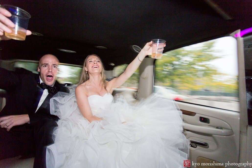 Bride and groom toast during A-1 Limo ride to Princeton wedding reception