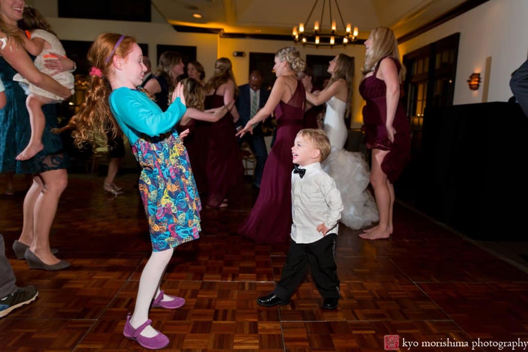 Girl and little boy laugh with each other during Cherry Valley Country Club wedding dance