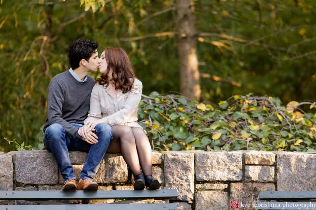 Prospect Park engagement photo on a stone wall photographed by Kyo Morishima