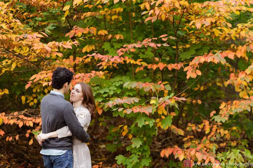 Engagement photo with fall leaves in the background at Prospect Park in Brooklyn, photographed by Kyo Morishima