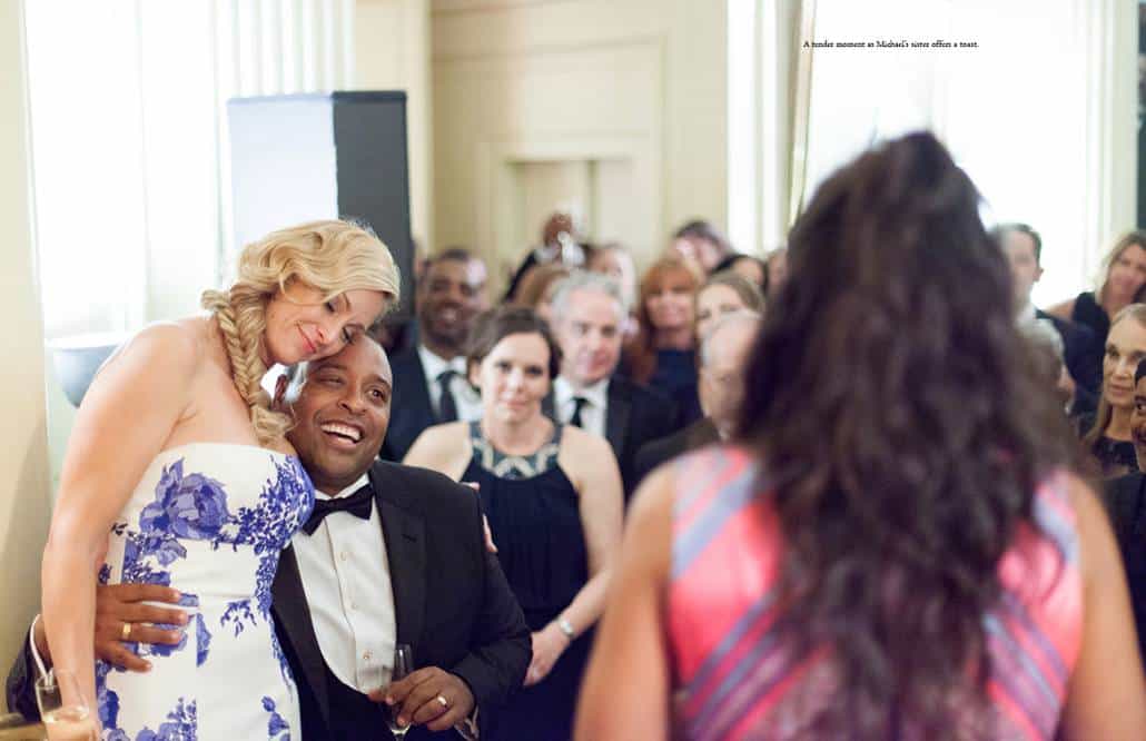 Bride wearing Monique Lhuillier and groom listen to toast by groom's sister during Lotos Club wedding reception 