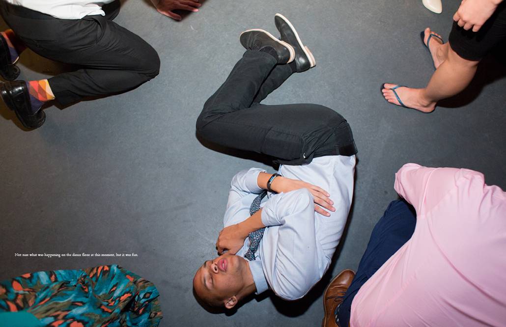 A wedding guest in the fetal position during raucous dancing at Green Building wedding with DJ OP!