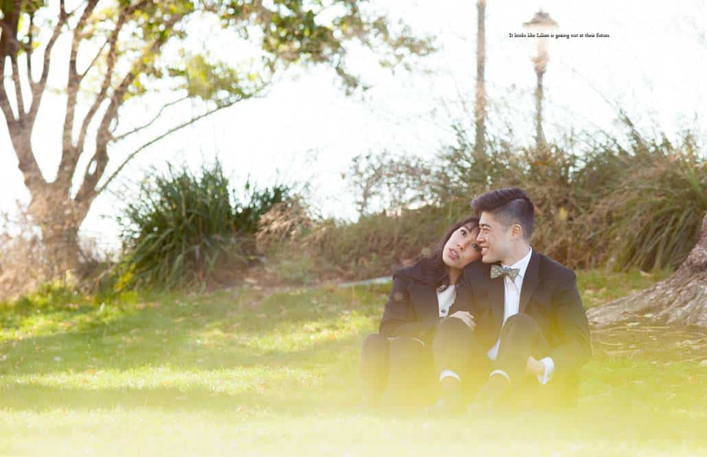 Couple sits on the grass in a lower Manhattan park, photographed by NYC documentary wedding photographer Kyo Morishima