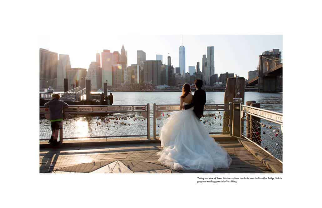 Japanese bride and groom gaze out at Manhattan from next to the Brooklyn Bridge; iconic Brooklyn wedding photo by Kyo Morishima