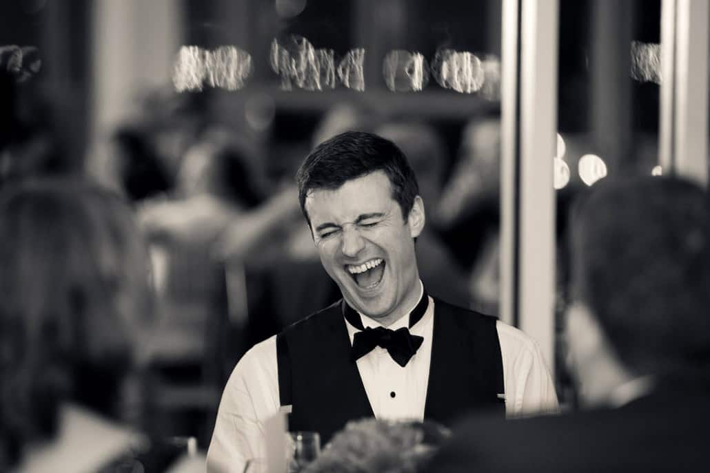 Groom laughing at Battery Garden Wedding Reception, NYC