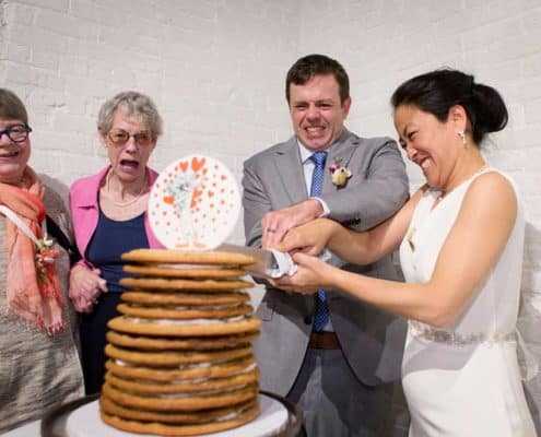 Rustic wedding cookie cake cutting, at Invisible Dog Art Center, Brooklyn, NY
