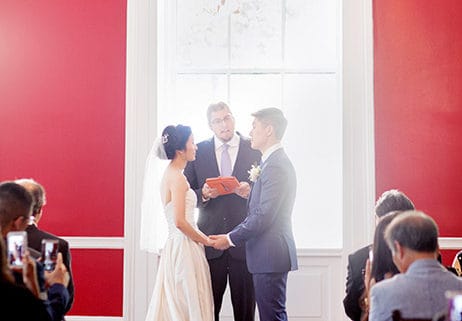 Red wall wedding ceremony at India House, NYC