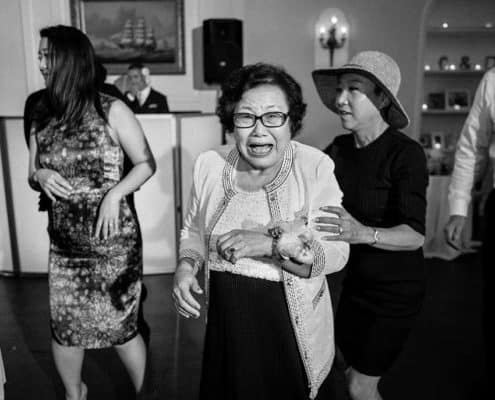 A grandma dancing at a wedding reception at India House NYC
