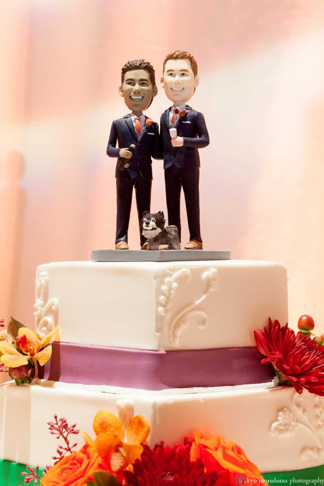 Bobblehead wedding cake toppers with cake by Cramer Bakery