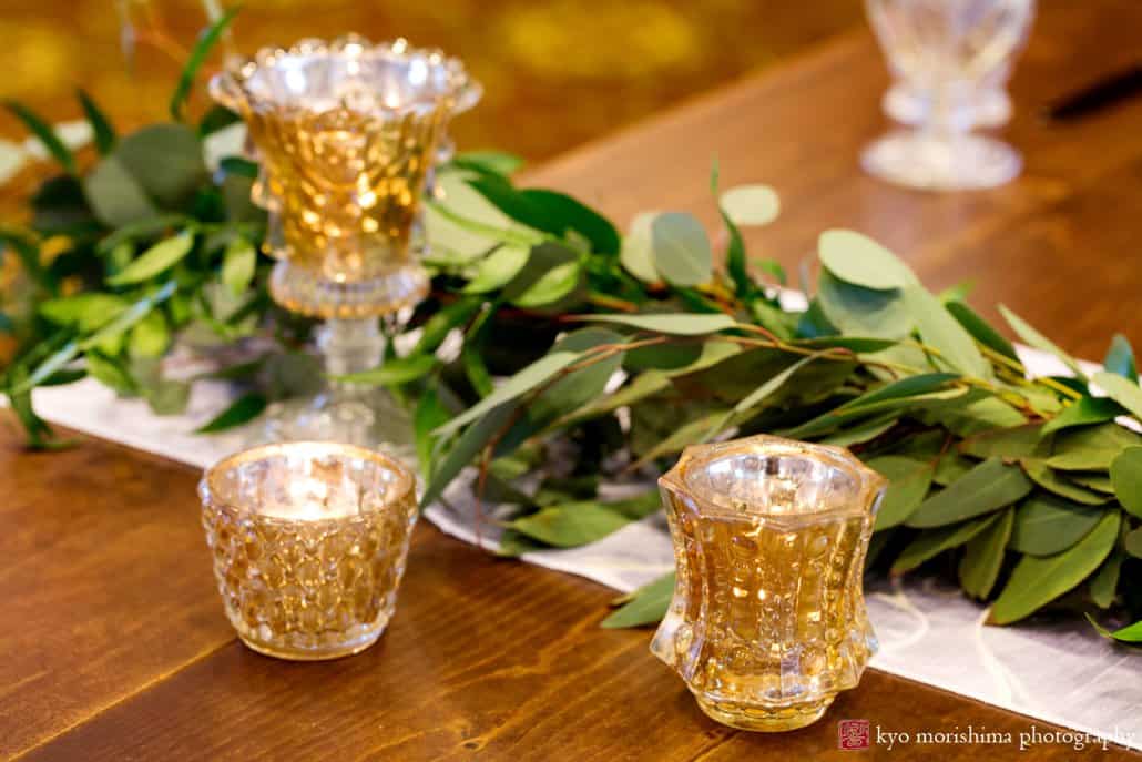 Unique and simple wedding ideas: Italian ruscus greenery wedding decor with gold tea candle receptacles at the Nassau Inn's Princeton wedding show