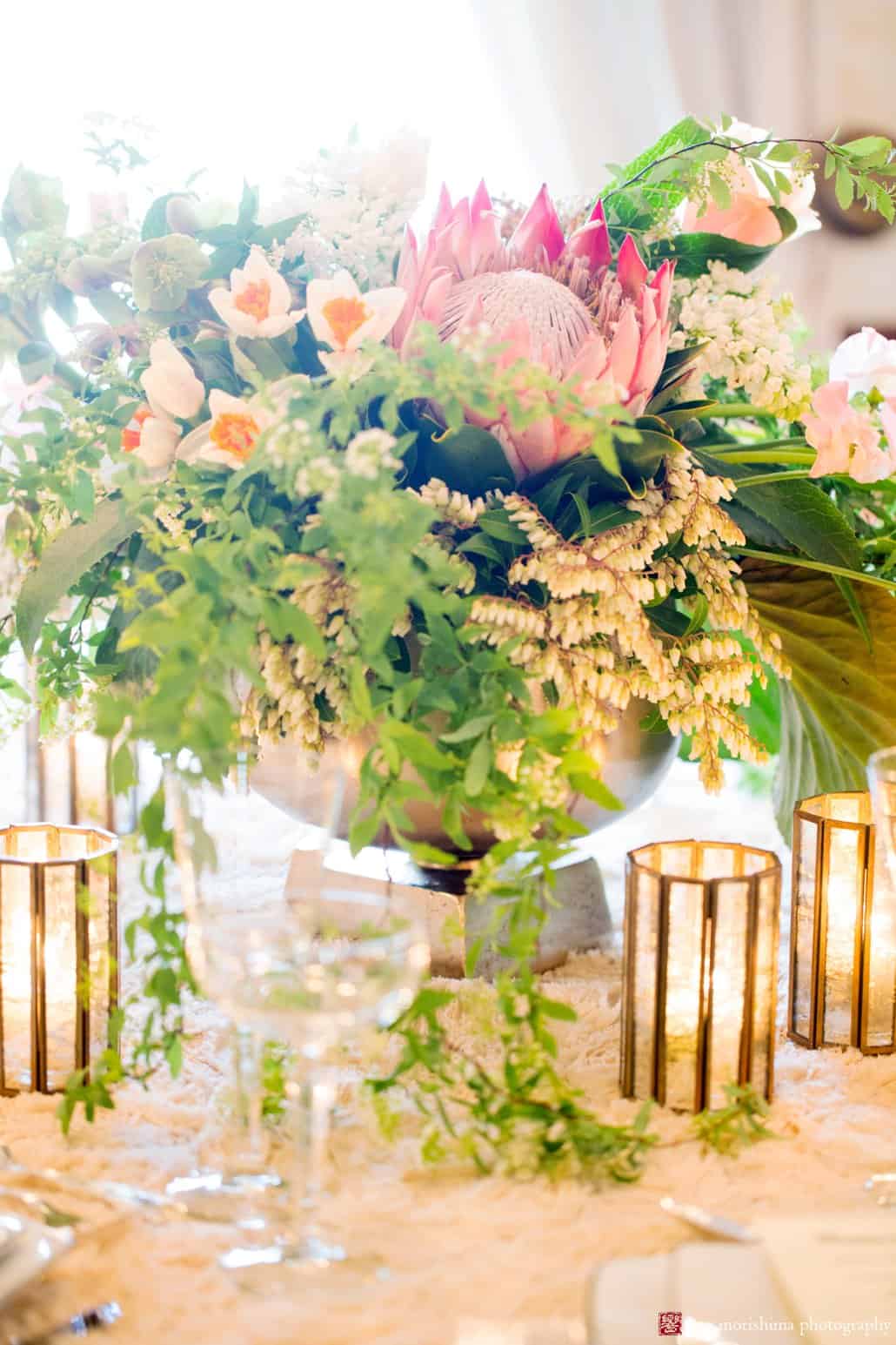 Unique and simple wedding idea: a single protea flower in tabletop centerpiece. This design is by Viburnum Designs in Princeton.