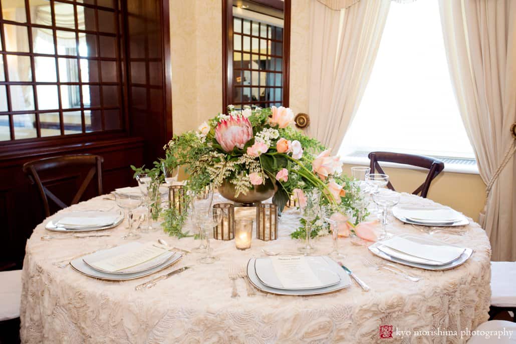 Wide view of flower arrangement with protea; wedding centerpiece by Viburnum Designs in Princeton.