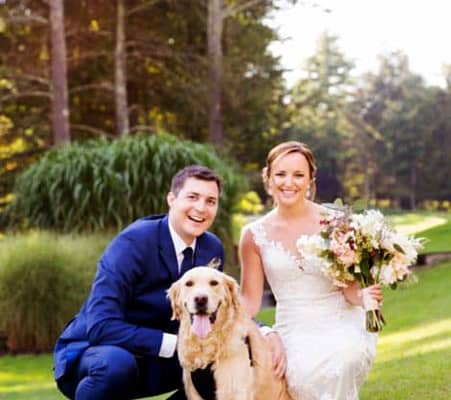 Wedding portrait with dog: bride and groom with golden retriever at Woodloch Pines Resort wedding