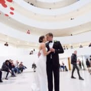 Bride and Groom kiss in middle of Guggenheim where they had their first date. Veka Bridal wedding dress. Black tux. New York wedding photographer. Guggenheim NYC wedding