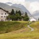 Hotel Sonne, Switzerland European destination wedding, winding road, grassy hills, Swiss Alps.