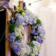 Blue and green wedding wreath with hydrangea, roses, in wedding tent, Dahlia's Florist, Spring Lake NJ, wedding photographer.