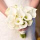 white calla lily bridal bouquet held by bride in lace gown, Polka Dot events, Central Park NYC wedding photographer.