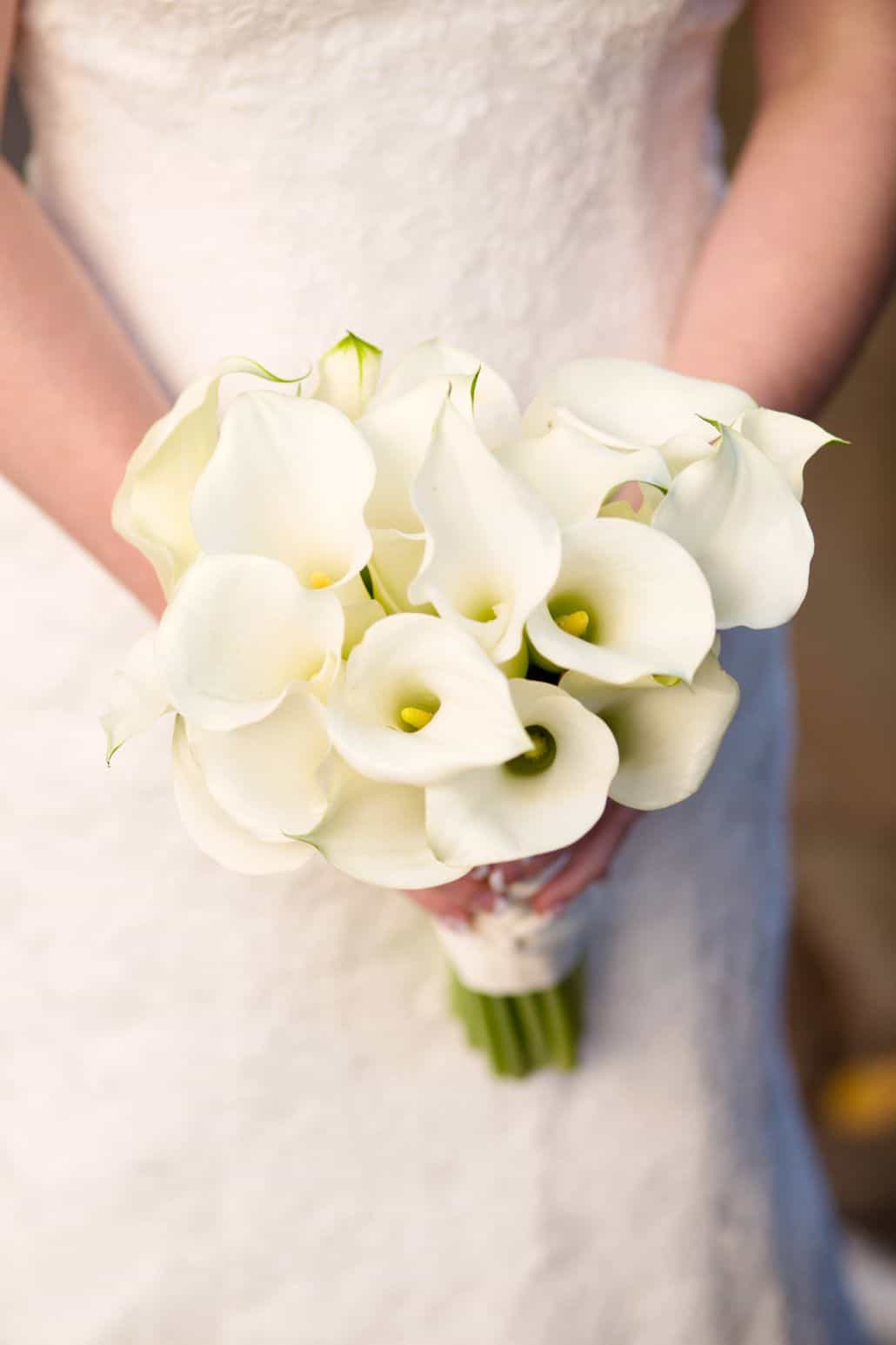 white calla lily bridal bouquet held by bride in lace gown, Polka Dot events, Central Park NYC wedding photographer.