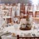 wedding table settings with white tablecloths, wooden tiered centerpiece, succulents in hypertufa pots, taupe napkins, bread and butter plates, wooden chiavari chairs, Front and Palmer, Philadelphia, PA wedding photographer, DIY wedding flowers.