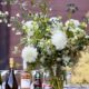 White dahlias with indigo accent flowers in wedding table centerpiece with beer and wine selections. flower wholesaler, flower district manhattan, the green building brooklyn NY, New York wedding photographer. DIY wedding flowers.