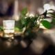 close up wedding photo of tea light candle and green foliage at the green building in brooklyn NY. Evening wedding photography, new york wedding photographer. flower wholesaler, flower district, manhattan. DIY wedding flowers.