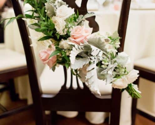 white, pink and sage floral chair swag, dark wood chair, Lotos Club NYC, Fleur du Mois Florist, New York wedding photographer.