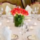 orange and yellow tulip with green base wedding centerpiece, tealights, white napkins, clear stemware, Karen Brown Events NYC wedding photographer.