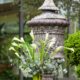 Calla Lily, fern and eucalyptus floral arranement in front of large urn at Jasna Polana wedding, Princeton, NJ. Janet Makrancy's weddings and parties florist. New Jersey wedding photographer.