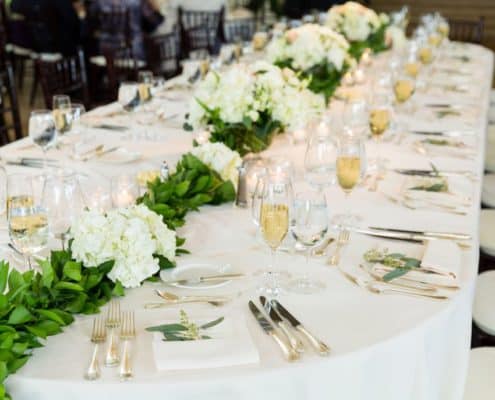 Hydrangea and leaf centerpiece runner, white table linens accented with eucalyptus, champagne, black chiavari chairs, Janet Makrancy's Weddings and Parties, Jasna Polana Princeton NJ wedding photographer.