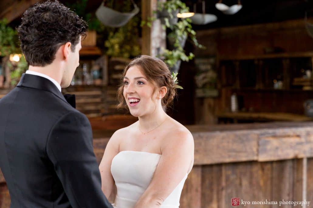 Bride holds groom's hands while saying vows at Blooming Hill Farm wedding. Designer Loft bridal gown, Summer NYC wedding photographer. Hudson Valley Kyo Morishima Photography