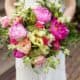 bride holds pink, yellow and fuscia bridal bouquet, peonies, roses, hydrangea, Kristin Rockhill florist, Nassau Inn, Princeton, NJ wedding photographer.