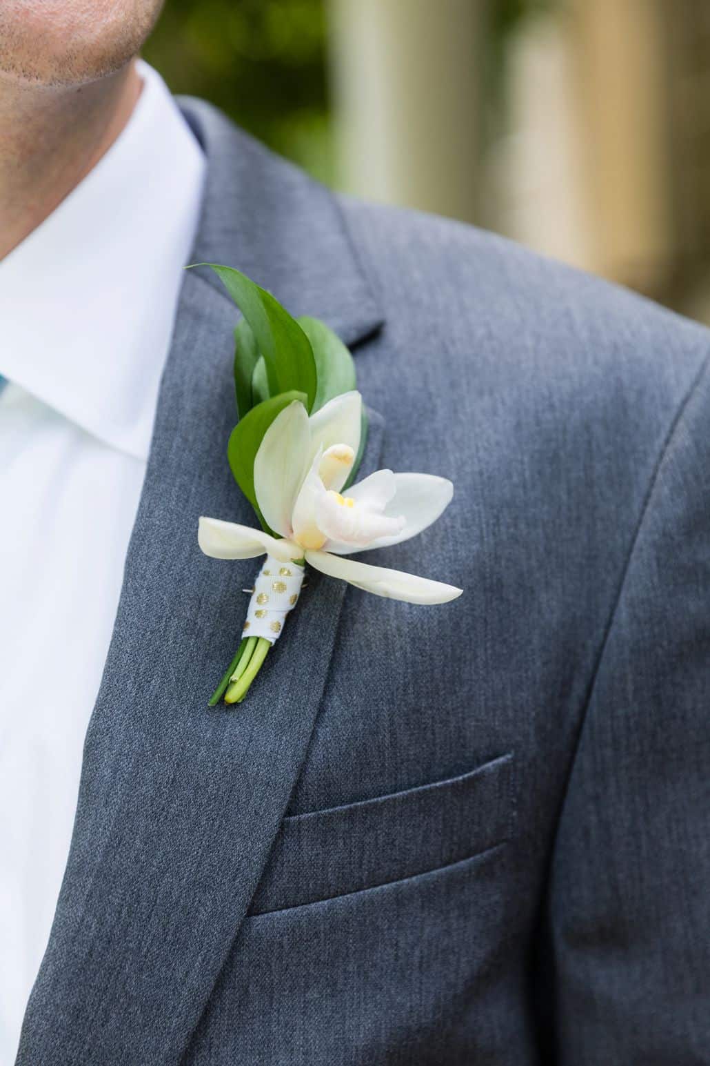 honeysuckle boutineer wrapped with gold polka dot ribbon. dark grey suit, Kristin Rockhill florist, Nassau Inn, Princeton, NJ wedding photographer.