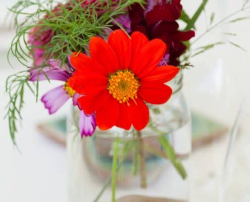 vivid wildflowers in mason jar wedding centerpieces. Jenn Florin florist. Brooklyn Grange, Brooklyn Navy Yard wedding photographer.