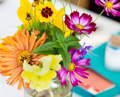 Bright pink, yellow and orange wildflowers with mint in mason jars wedding table centerpiece, Brooklyn Grange, Brooklyn Navy Yard, Jenn Florin florist, New york wedding photographer.