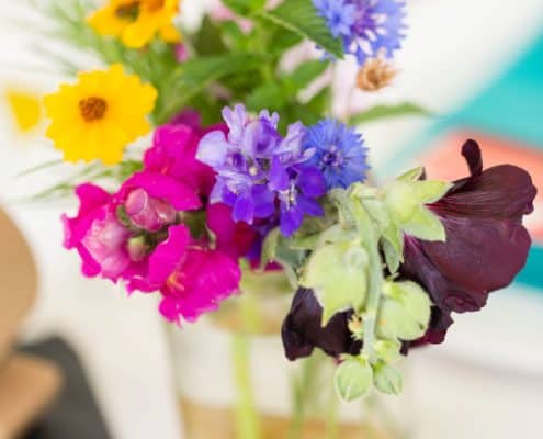 jewel tone wildflowers with mint in mason jar wedding table centerpiece Brooklyn Grange, Brooklyn Navy Yard, Jenn Florin florist, New York wedding photographer.