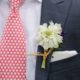 white scabiosa boutineer wrapped with raffia, dark gray suit, white pocket square, red tie with white hearts, Stem cut flowers florist, lake geneva, Wisconsin wedding photographer.