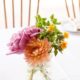 peach and pink dahlia and rose wedding table centerpiece in mason jar, white table cloth. Parkers Petals florist, Mohawk House, Sparta NY wedding photographer.